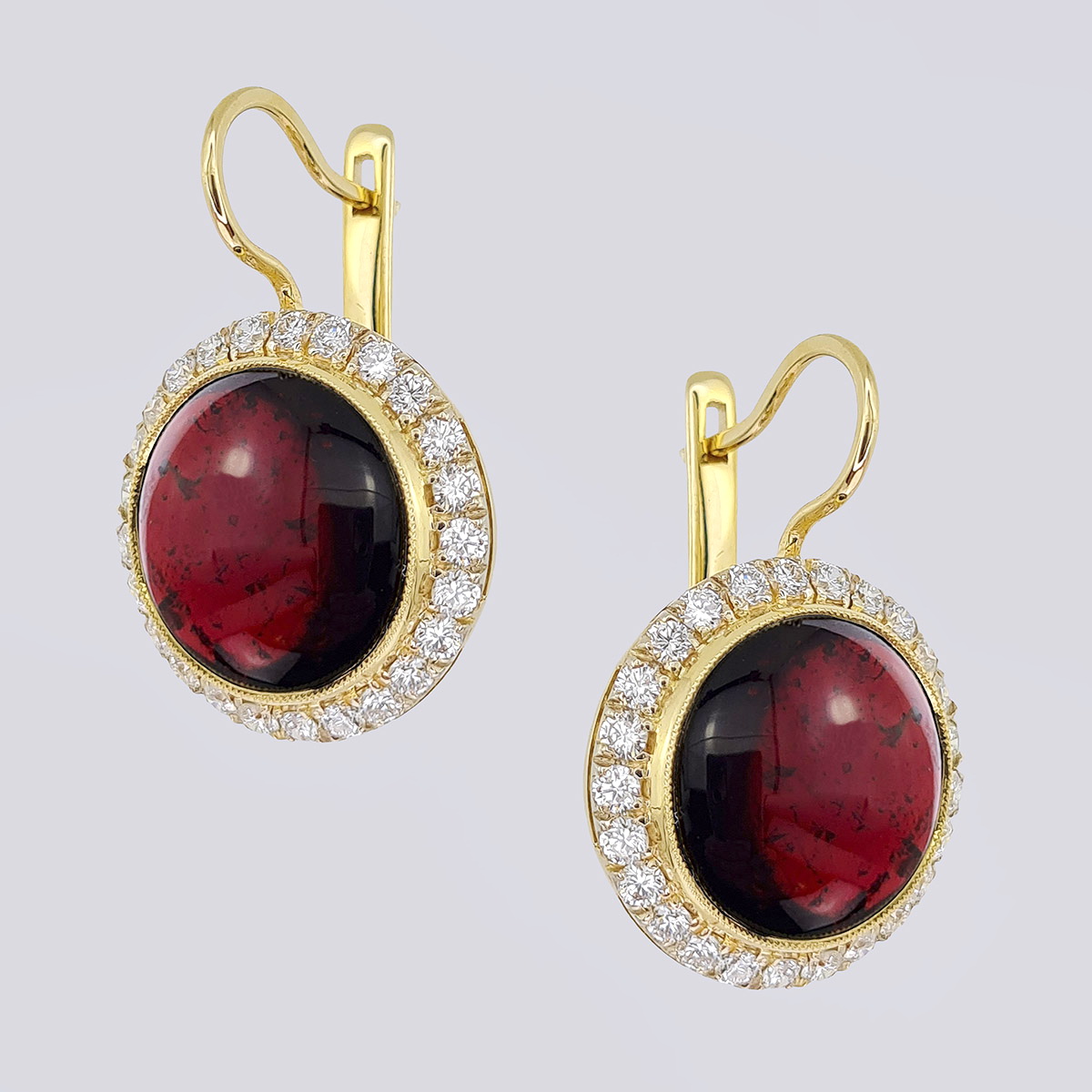 Золотые серьги 56 пробы с бриллиантами и природными гранатами
